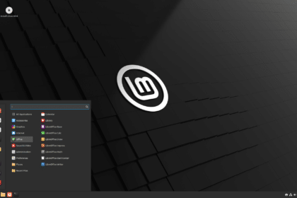 Imagem do Linux Mint LMDE 6 32 bits, com o logotipo do Linux Mint em destaque na tela.
